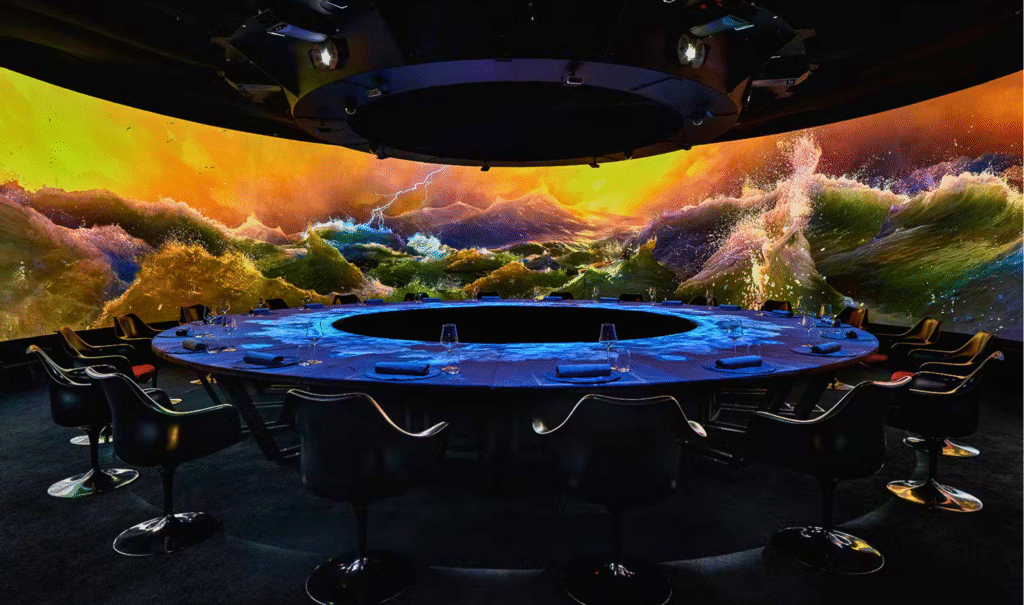 An avant-garde dish at Krasota, with immersive digital art projected onto the table during a unique dining experience in Dubai.